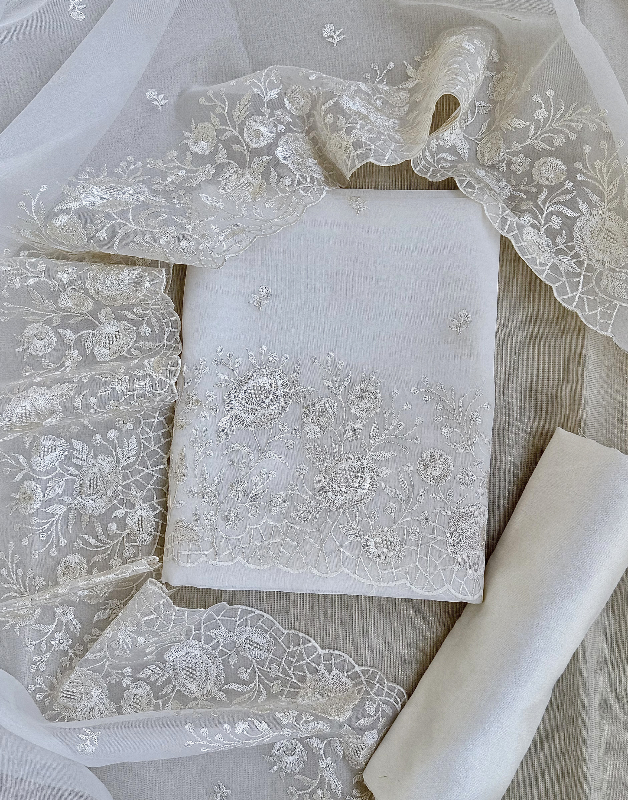 Off White Organza Unstitched Suit with Self Floral Embroidery