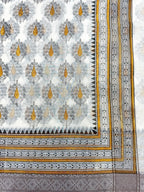 Off White Supernet Cotton Saree with Mustard Leaf Embroidery & Contrast Border