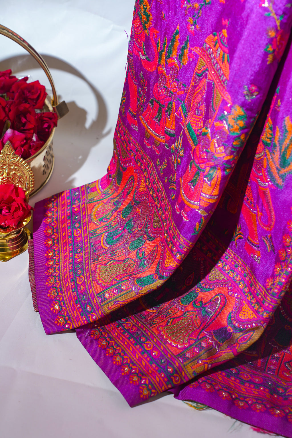 Colorful fabric with intricate patterns on a white background