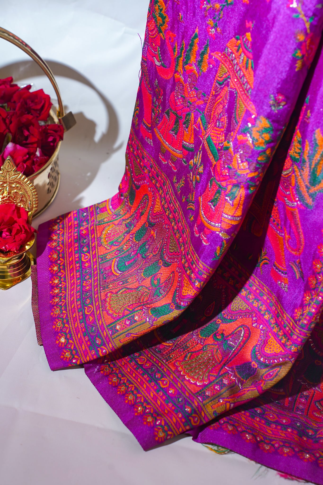 Colorful fabric with intricate patterns on a white background