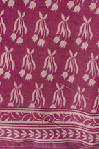 Pink fabric with white floral pattern on a white background