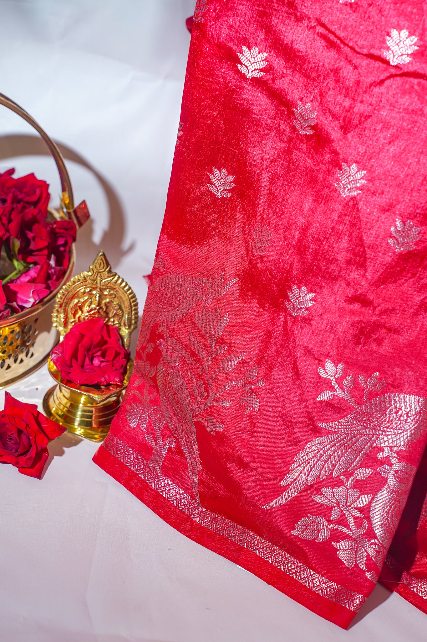 Red Saree with silver floral patterns on a white background