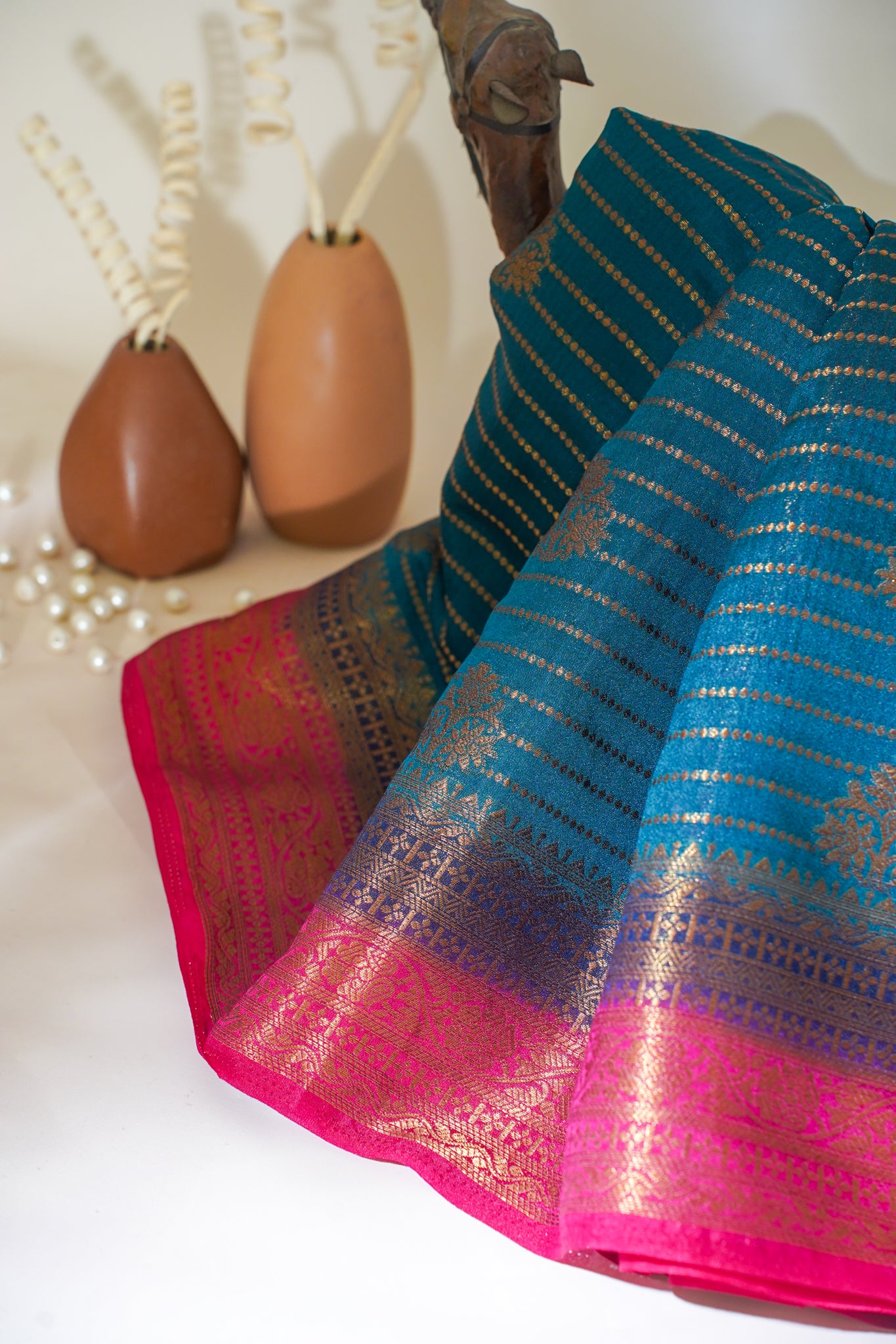 Colorful fabric with pink and blue patterns on a white surface
