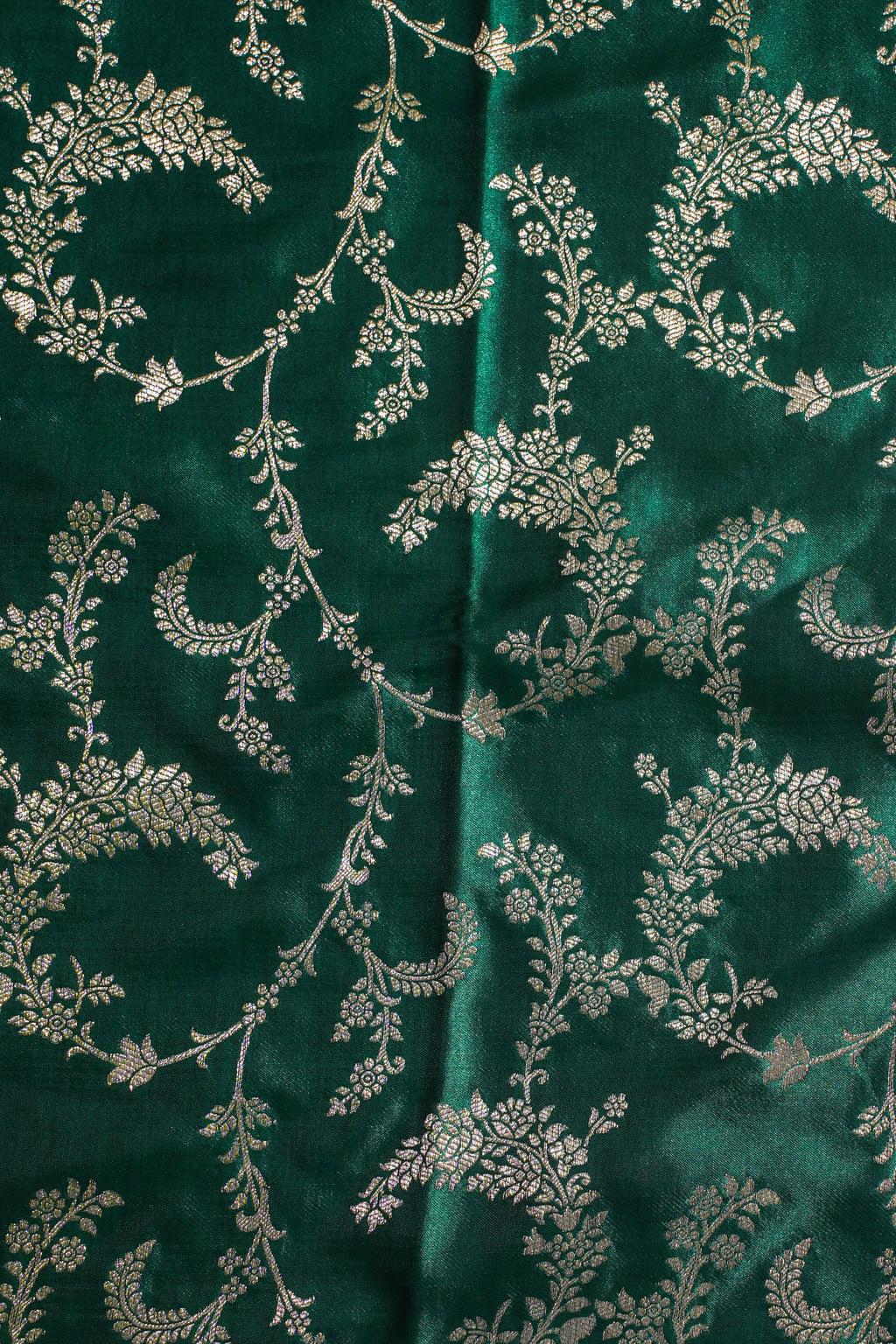 Green fabric with silver floral pattern