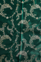 Green fabric with silver floral pattern