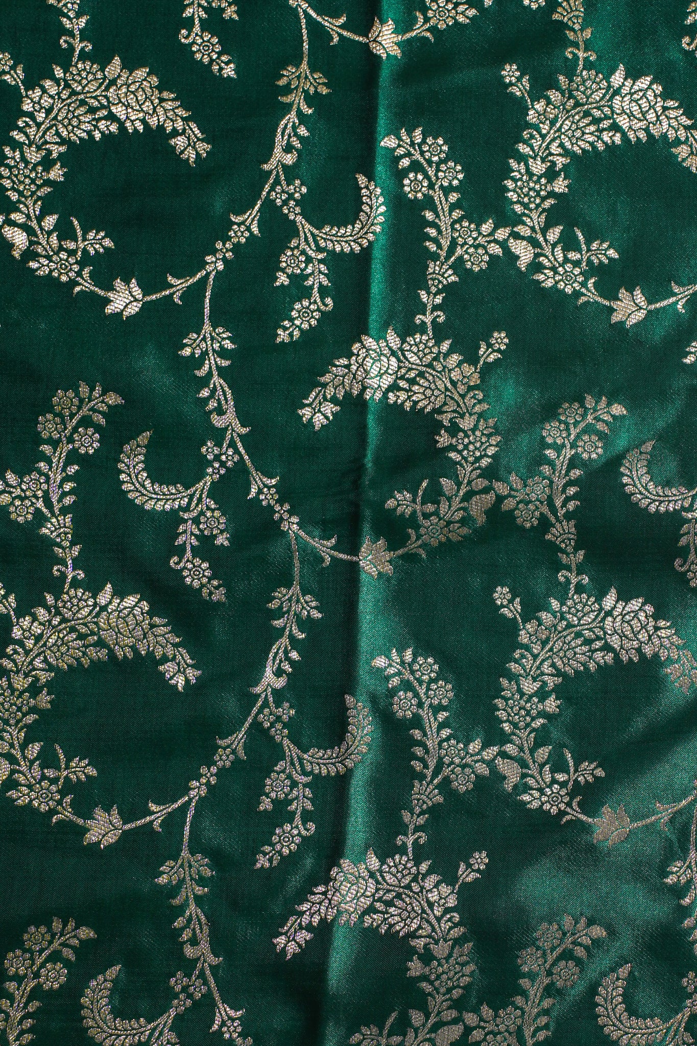 Green fabric with silver floral pattern