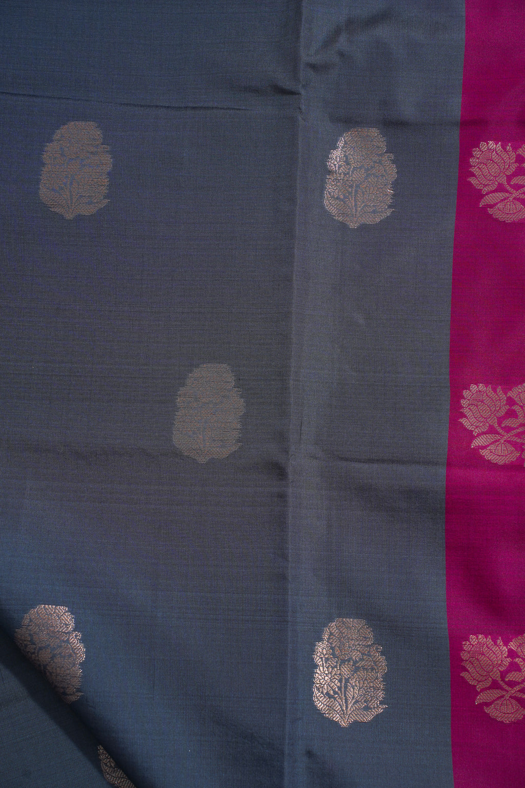 Blue fabric with gold floral patterns and a pink border