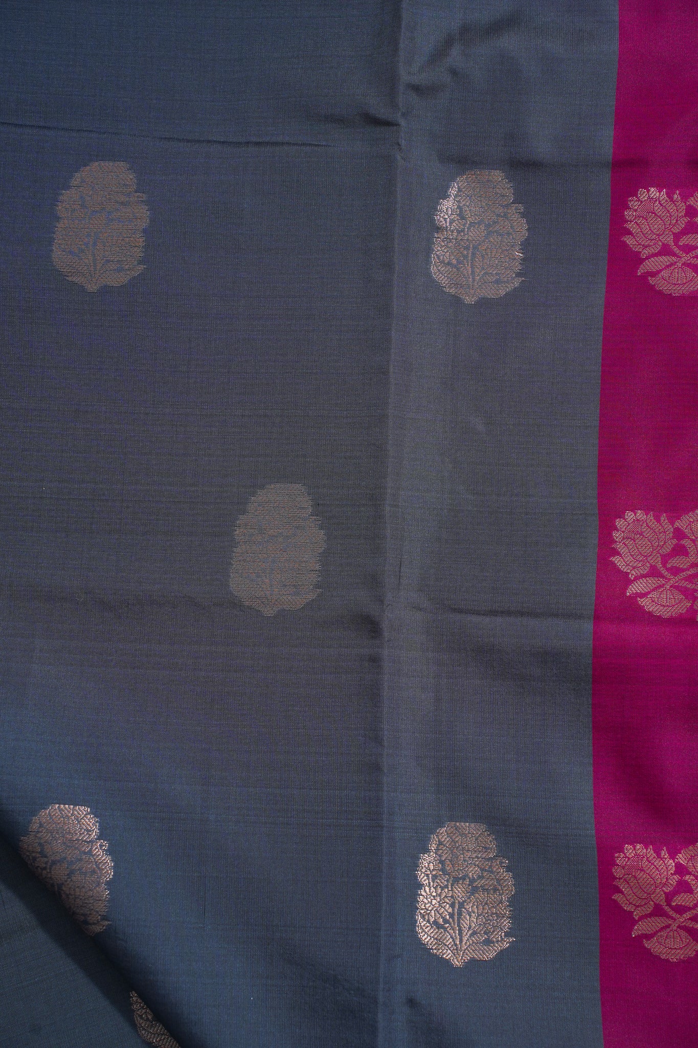 Blue fabric with gold floral patterns and a pink border
