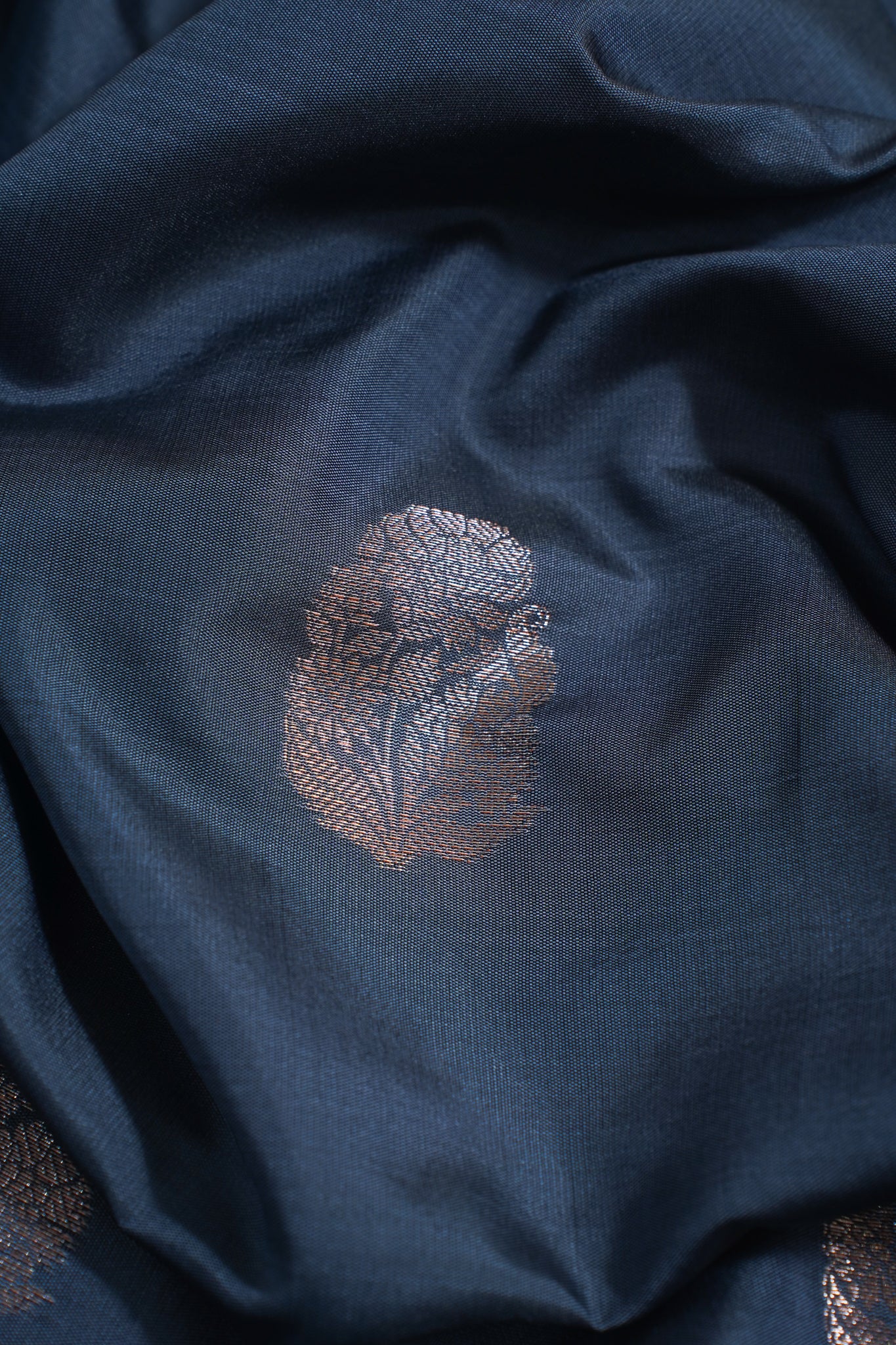 Navy blue fabric with a subtle patterned design
