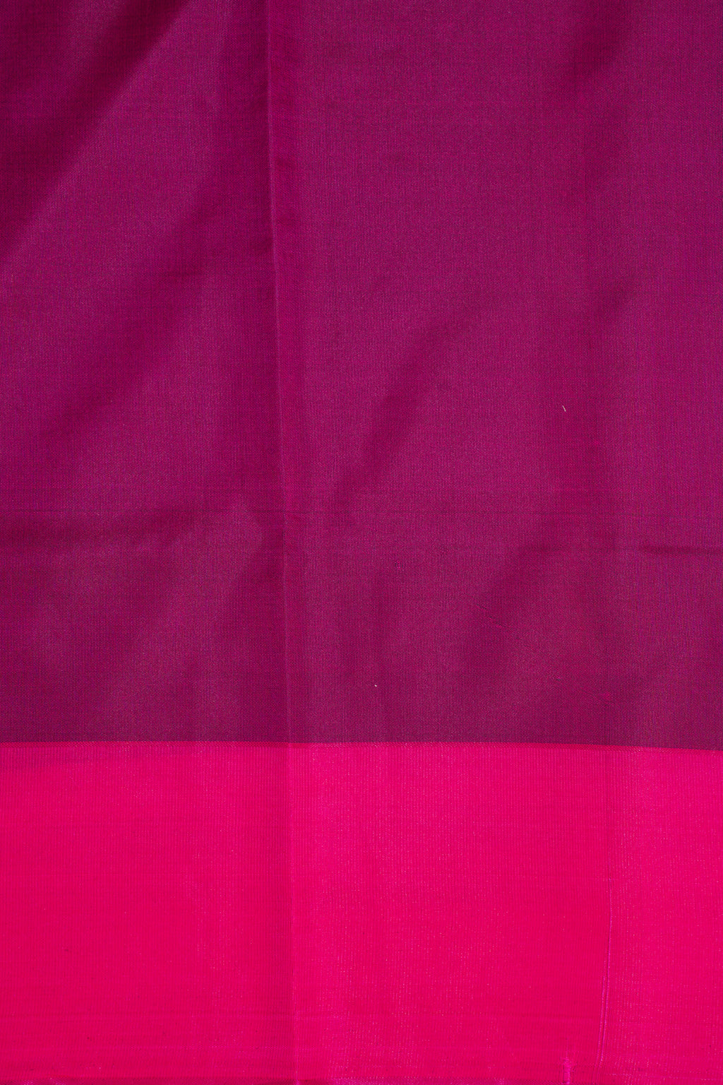Close-up of pink fabric with a subtle pattern