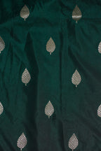 Dark green fabric with silver leaf patterns