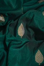 Close-up of dark green fabric with leaf patterns