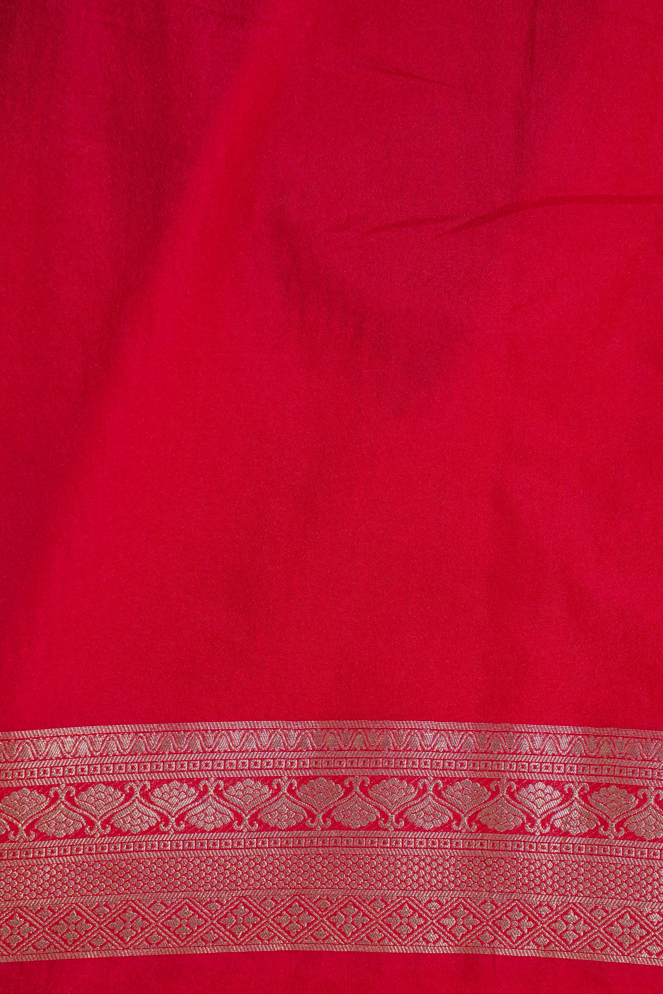 Red fabric with a decorative border