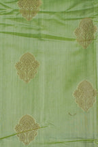 Green fabric with gold floral patterns