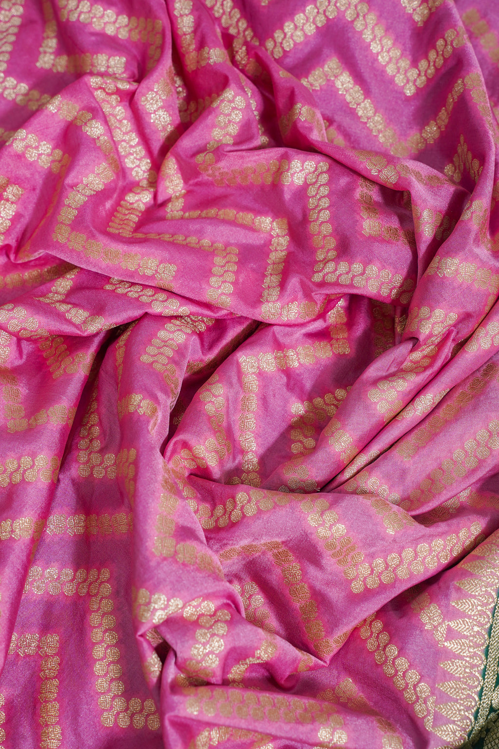 Pink fabric with gold patterns