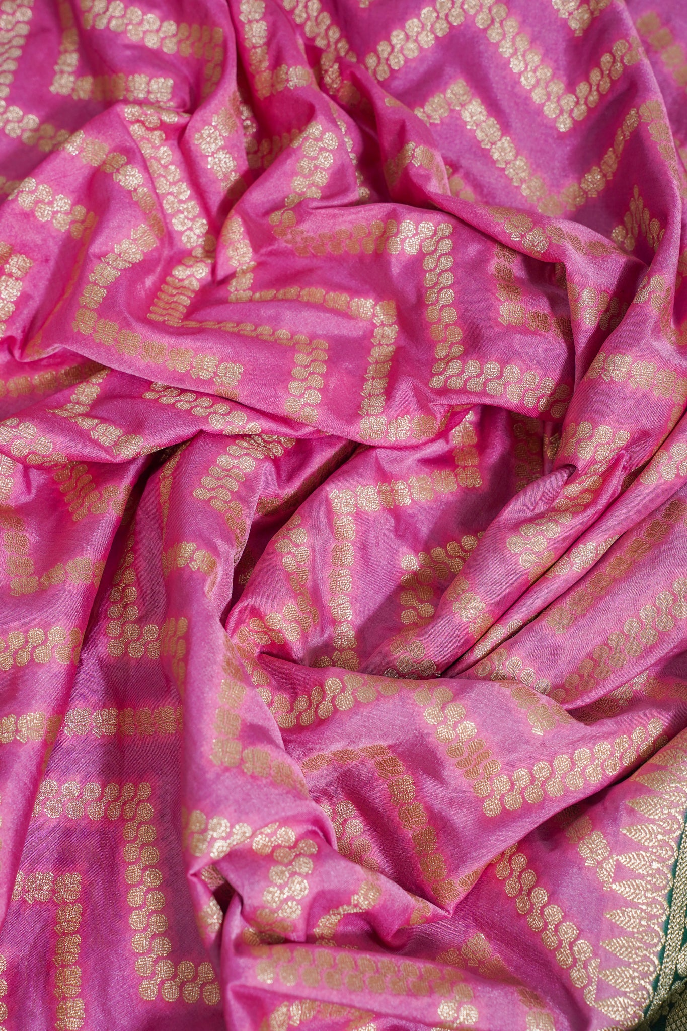 Pink fabric with gold patterns