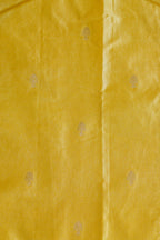 Close-up of yellow fabric with subtle pattern