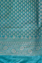 Teal fabric with white floral pattern