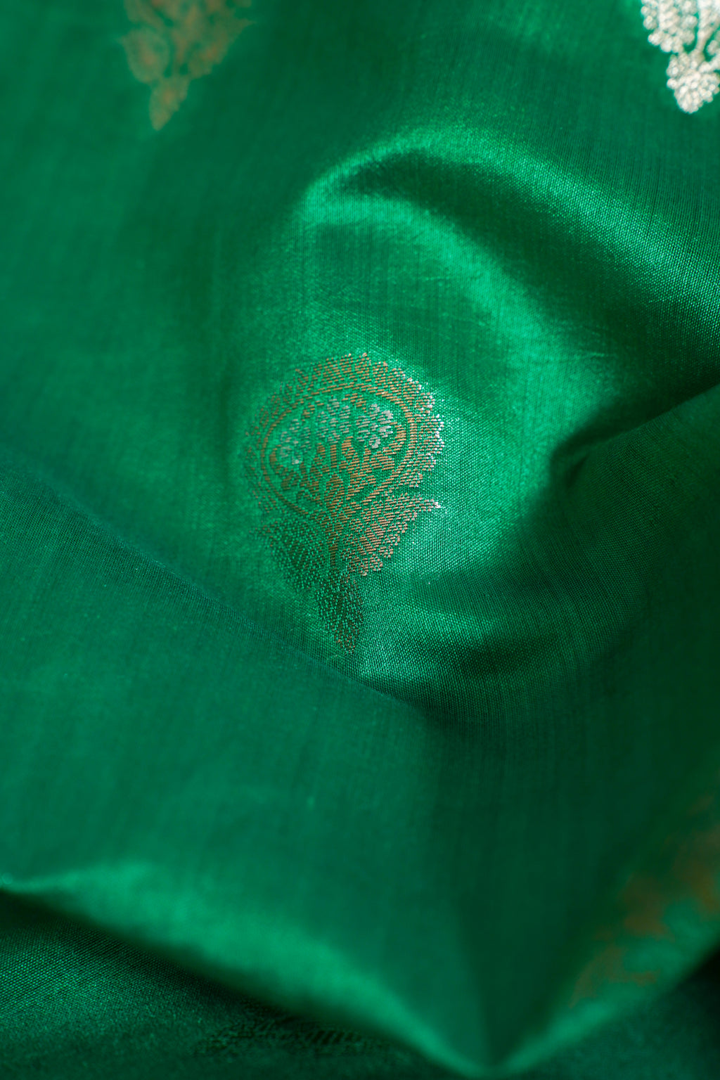 Close-up of green fabric with intricate patterns