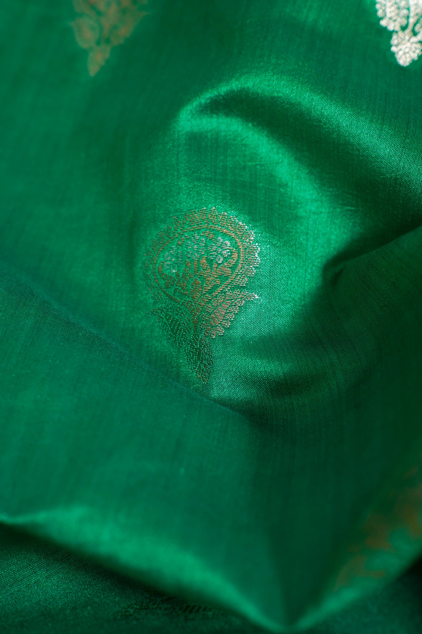 Close-up of green fabric with intricate patterns