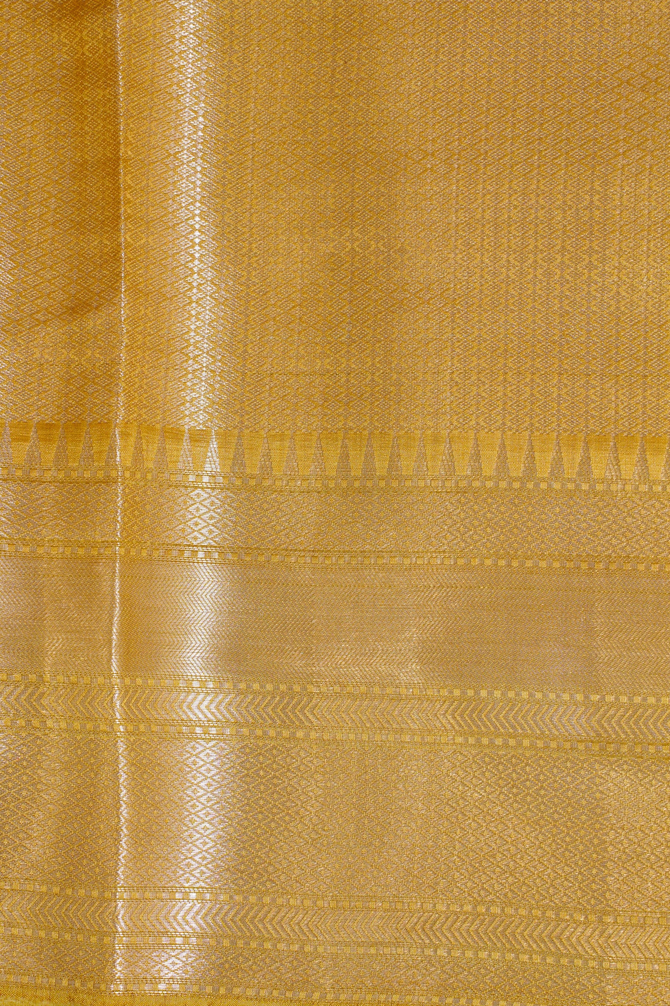 Close-up of a yellow fabric with a subtle pattern