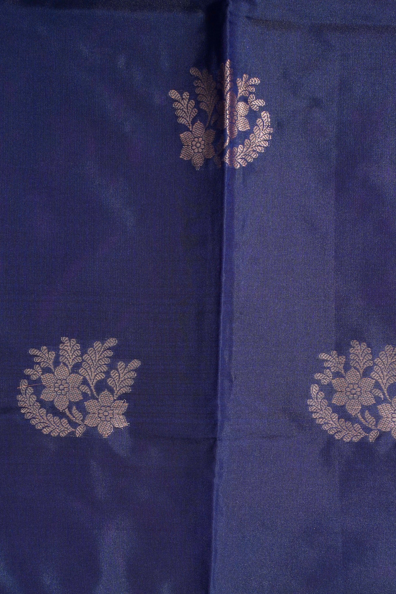 Navy blue fabric with gold floral patterns