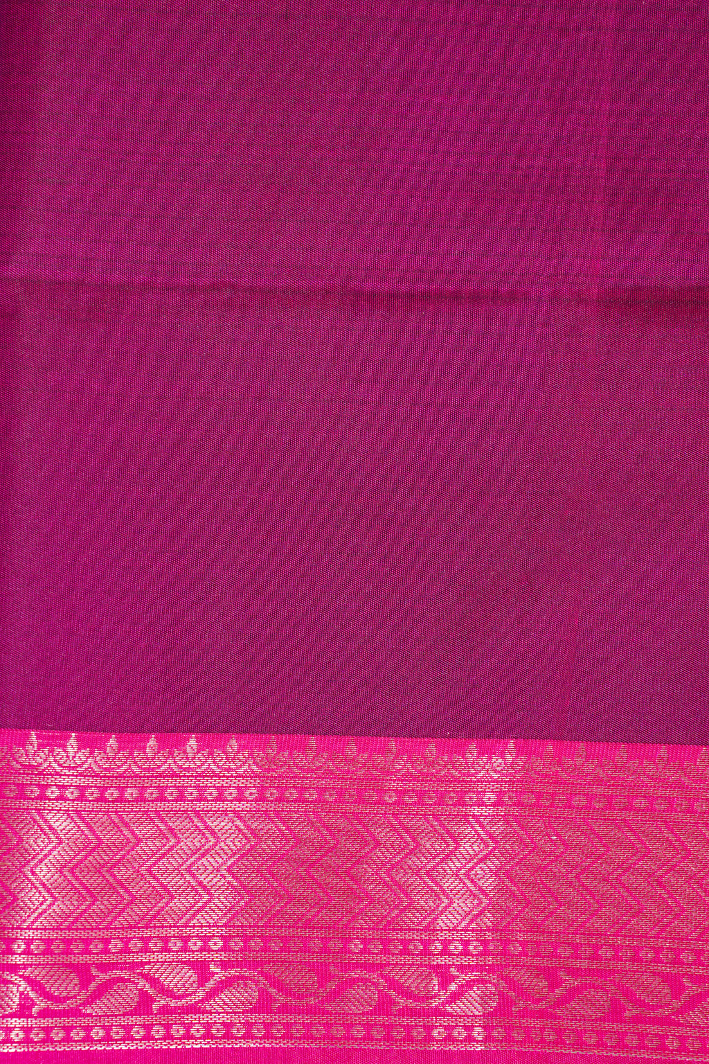 Purple fabric with a pink border featuring a geometric pattern
