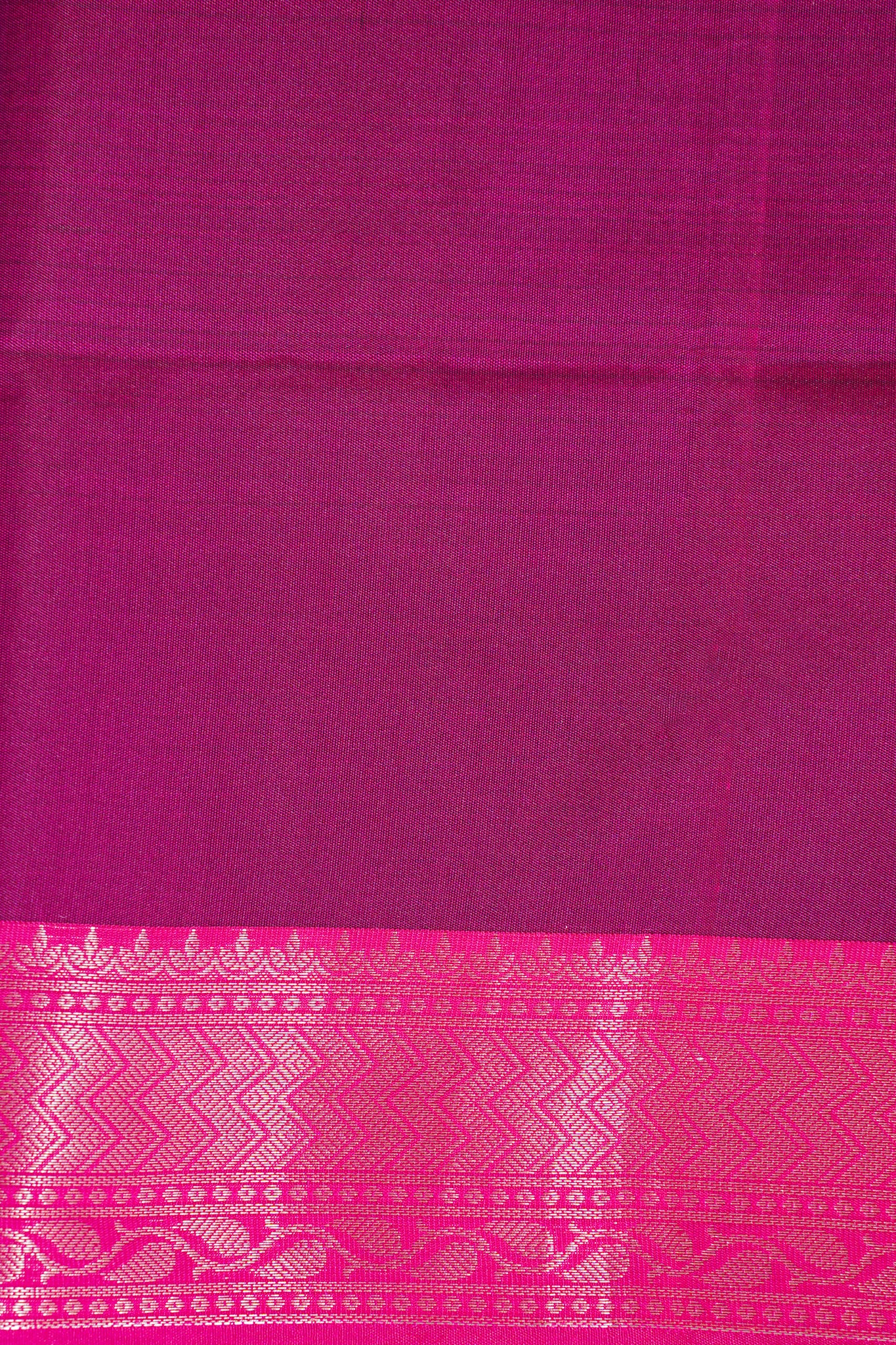 Purple fabric with a pink border featuring a geometric pattern