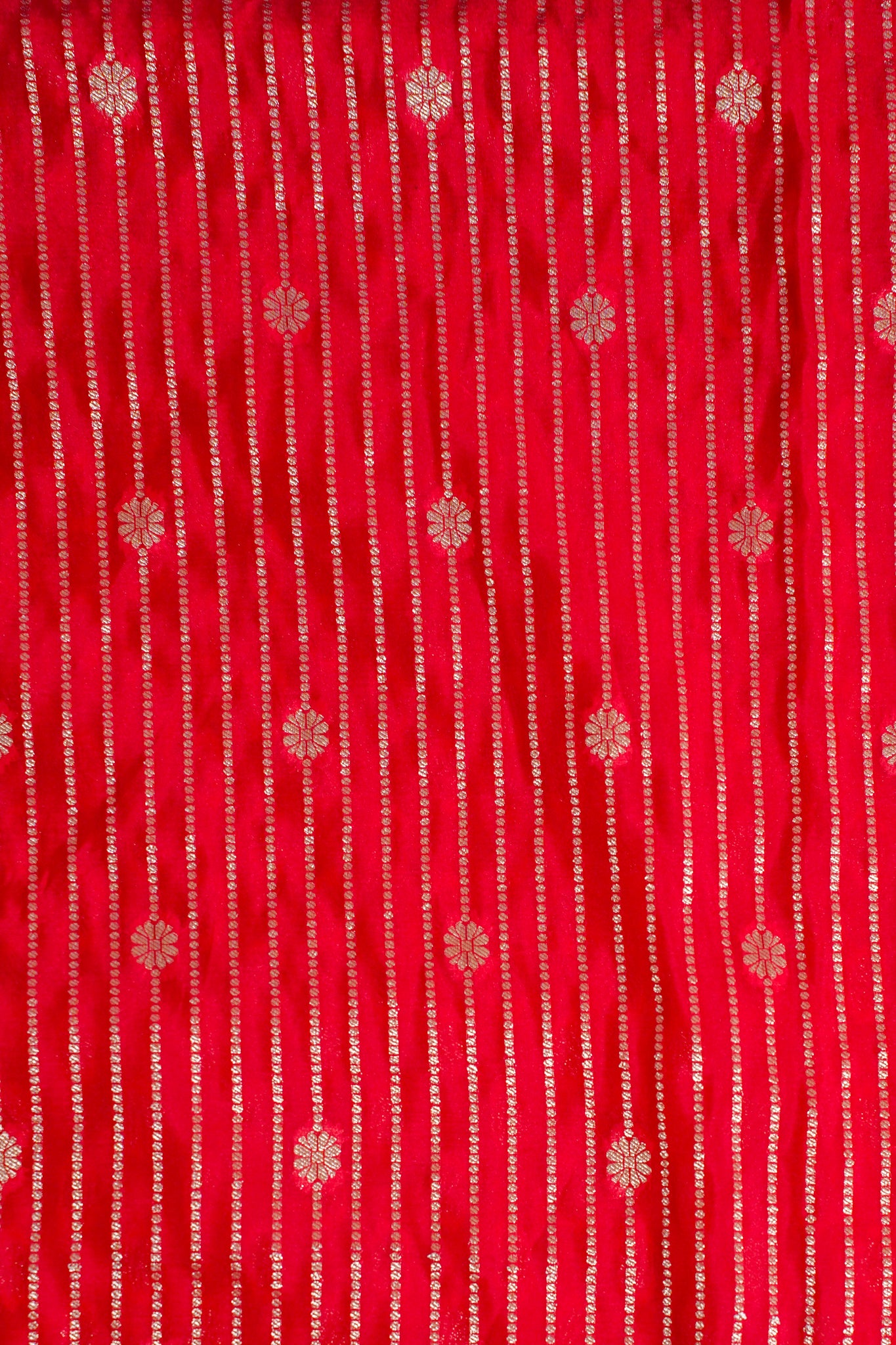 Red fabric with gold floral patterns