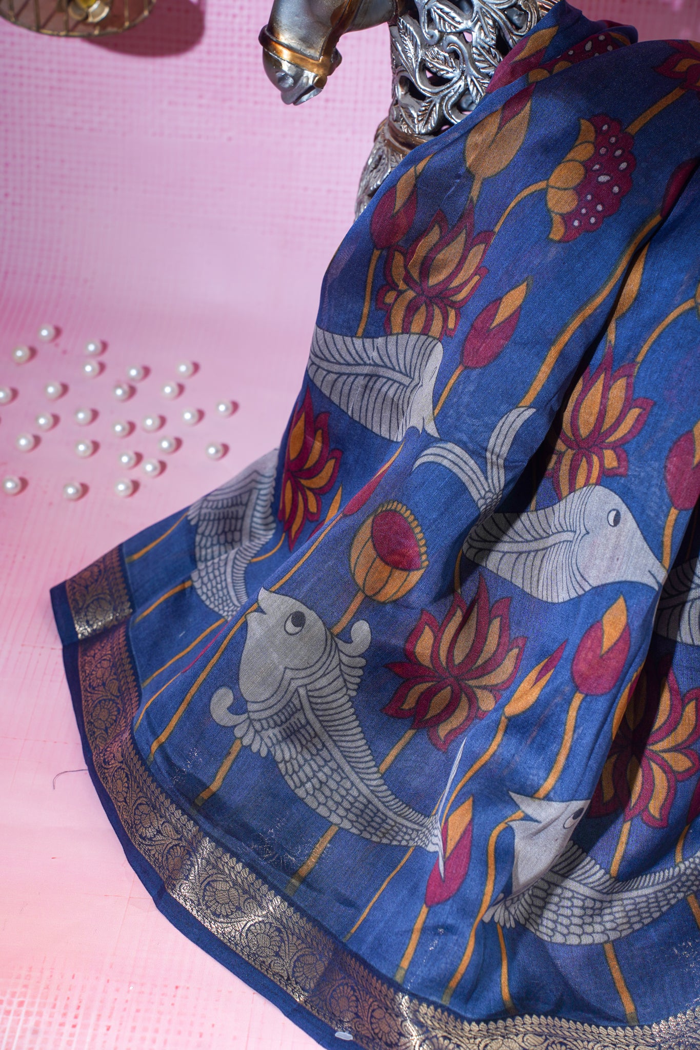 Blue saree with Fish and floral patterns on a pink background