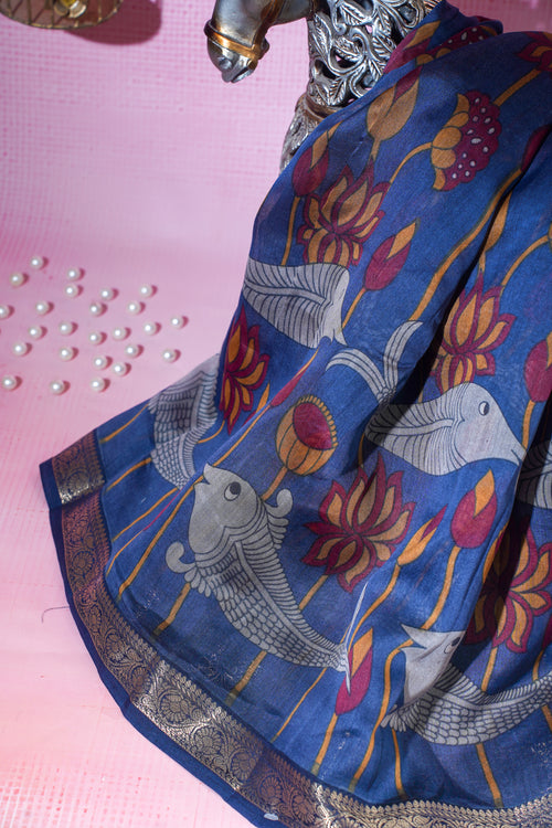 Blue saree with Fish and floral patterns on a pink background