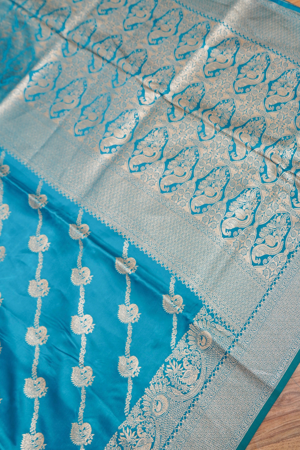 Turquoise Blue Mashroo Silk Saree with Zari Buti and Ornate Border